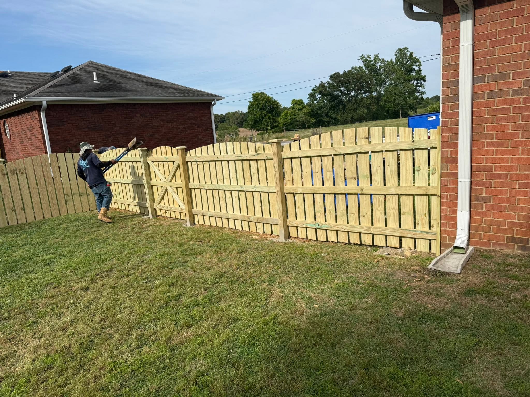 Scalloped wood fence and gate install with Vaughn Fence crew in Northern Alabama